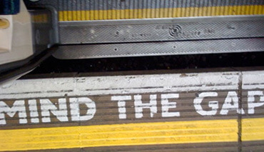 Mind The Gap painted warning underfoot between the platforms and trains