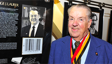 George Laurer, who designed the modern barcode